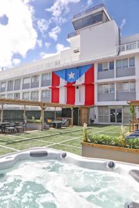 a building with a large flag painted on it at San Juan Airport Hotel in San Juan