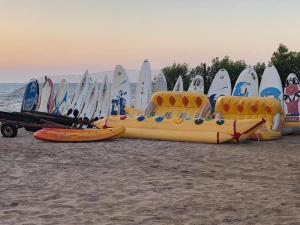 a group of surfboards lined up on the beach at Seaview Chalets in Porto South Beach - Families Only in Ain Sokhna