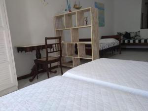 Łóżko lub łóżka w pokoju w obiekcie Angra dos Reis - Porto Caieira, RJ
