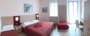 Postel nebo postele na pokoji v ubytování Albergo Riva