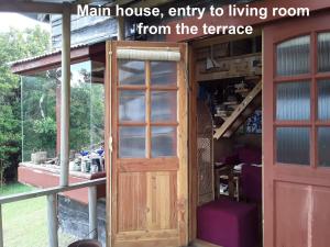 a man house entry to living room from the terrace at karukinka in Chonchi +95 photos