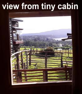 a window with a view from tiny calium at karukinka in Chonchi