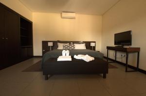 Ένα ή περισσότερα κρεβάτια σε δωμάτιο στο Songo Hotel By Montebelo