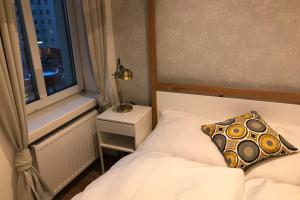 Postel nebo postele na pokoji v ubytování ZEUS Design Apartments Modern&Warm City