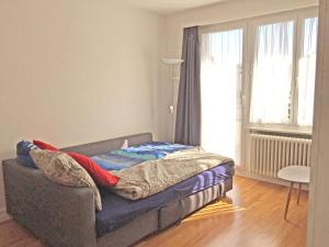 מיטה או מיטות בחדר ב-Ferienwohnung in Bern