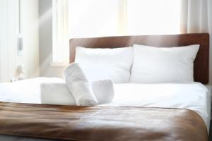 Postel nebo postele na pokoji v ubytování Hotell Furusund