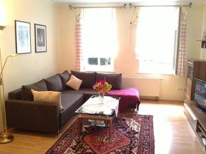 a living room with a couch and a table at Haus Amelie in Bad Salzungen