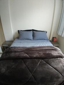 Cama o camas de una habitación en Apto Aconchegante - 4 pessoas - próximo centro de Florianópolis