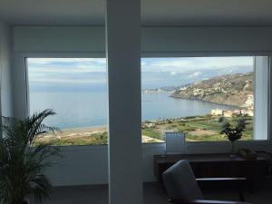 a view of the ocean from a living room window at Balcón del Albayzín in Salobreña