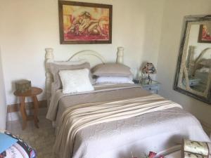 Cama o camas de una habitación en Casa Confortável