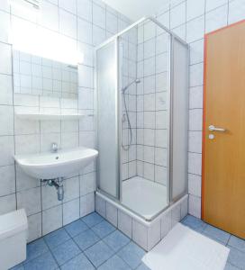 a bathroom with a shower and a sink at Jutel Hinterstoder in Hinterstoder