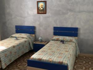 Postel nebo postele na pokoji v ubytování Villetta Salento
