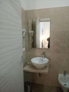 Ett badrum på Mediterranea Guest House