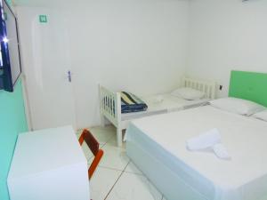 Cama o camas de una habitación en RAFAELLO HOTEL