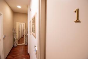 a hallway with a number one on the wall at Casual Stay Cairoli in Reggio di Calabria