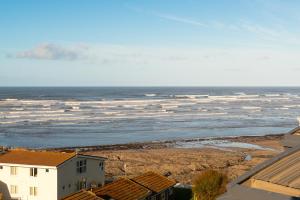 a view of the ocean from a building at West Beach - Holiday Apartments in Westward Ho