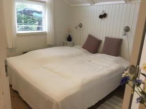 Krevet ili kreveti u jedinici u objektu Two-Bedroom Holiday Home for 6 in Vemmingbund