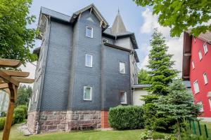 a house with a turret on the side of it at Haus Repin, Oberhof, historische Villa am Rennsteig, Thüringer Wald in Oberhof +40 photos