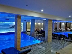 a swimming pool in a hotel with a view of the ocean at AMI apartman Kopaonik in Kopaonik