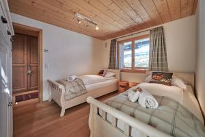 Postel nebo postele na pokoji v ubytování Chalet Bärgsunna Penthouse