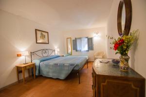 En eller flere senger på et rom på Agriturismo Casa Turchetti