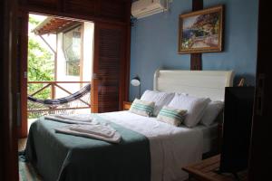 En eller flere senger på et rom på Casa da Imperatriz