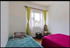 Cama ou camas em um quarto em Apartamento Valparaiso