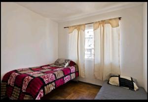 Cama ou camas em um quarto em Apartamento Valparaiso