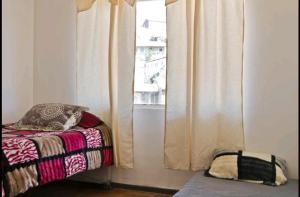 Cama ou camas em um quarto em Apartamento Valparaiso