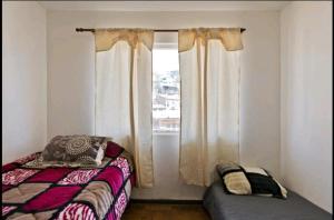 Cama ou camas em um quarto em Apartamento Valparaiso