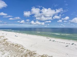a beach with a lot of people and the ocean at Summerchase 1 in Orange Beach