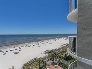 a view of the beach from the balcony of a building at Tradewinds Condos II in Orange Beach