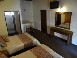 Letto o letti in una camera di Hotel Chapala Country