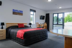 Ein Bett oder Betten in einem Zimmer der Unterkunft ASURE Central Gold Motel Cromwell