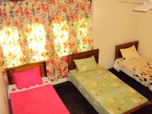 Postel nebo postele na pokoji v ubytování Lotus Hostel