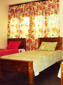 Postel nebo postele na pokoji v ubytování Lotus Hostel