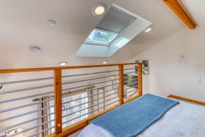 a bedroom with a bed and a window at Sequoia Cottage in Eureka