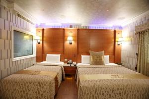 Voodi või voodid majutusasutuse Wen Sha Bao Motel-Xinying toas