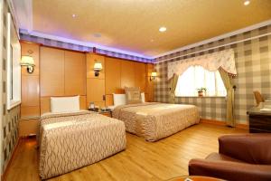 Voodi või voodid majutusasutuse Wen Sha Bao Motel-Xinying toas
