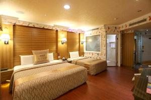 Voodi või voodid majutusasutuse Wen Sha Bao Motel-Xinying toas