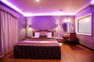 Voodi või voodid majutusasutuse Wen Sha Bao Motel-Xinying toas
