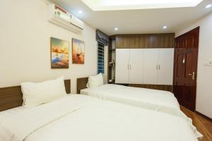Postel nebo postele na pokoji v ubytování Hanoi Veris Boutique Hotel & Spa + 35 fotografií