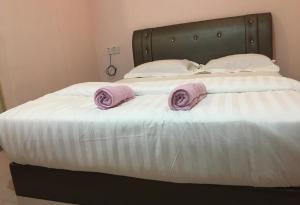 Postel nebo postele na pokoji v ubytování Anderson Hotel