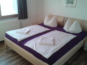 Posteľ alebo postele v izbe v ubytovaní Apartman Nóra