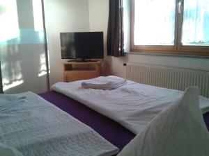 Posteľ alebo postele v izbe v ubytovaní Apartman Nóra