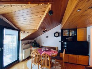 a dining room with a table and chairs at Apartma Snežinka in Kranjska Gora