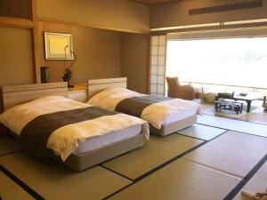 Voodi või voodid majutusasutuse Shiratama no Yu Kahou toas