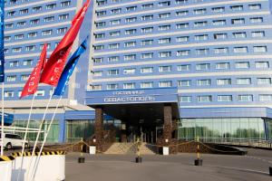 a building with flags in front of it at Sevastopol Modern in Moscow