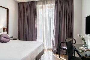 Posteľ alebo postele v izbe v ubytovaní Vincci Palace