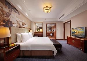 Postel nebo postele na pokoji v ubytování City Hotel Xiamen-Free Welcome Fruits + 37 fotografií